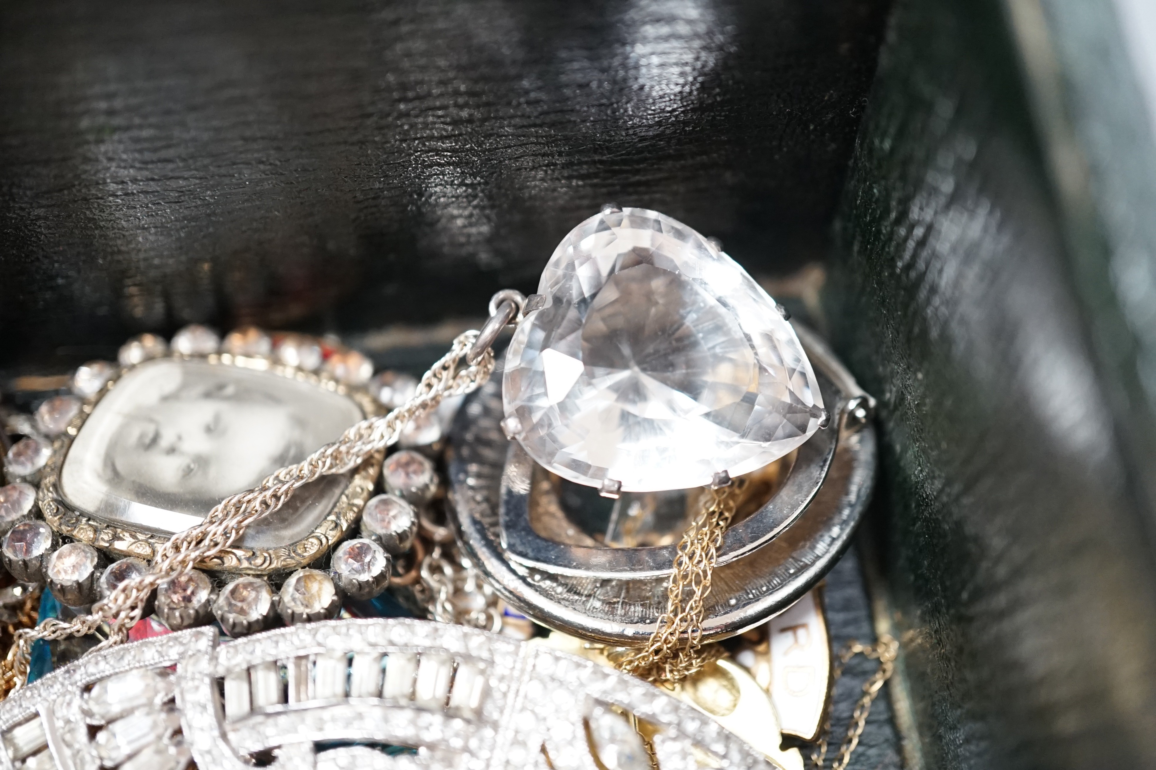 Mixed mainly costume jewellery including paste set necklace, pendant necklaces, silver lockets, lighters etc.